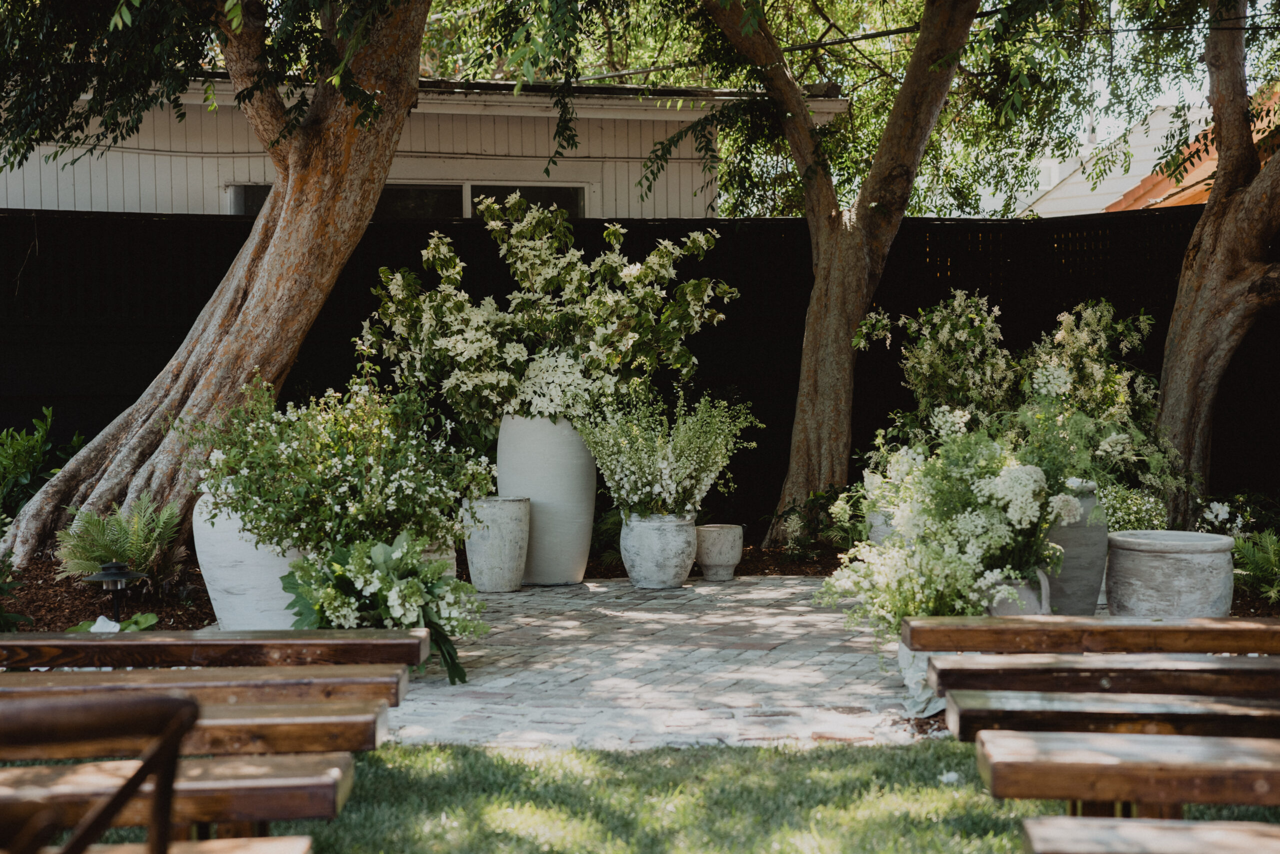 outdoor garden wedding in a private estate in the bay area. Large white florals for ceremony.